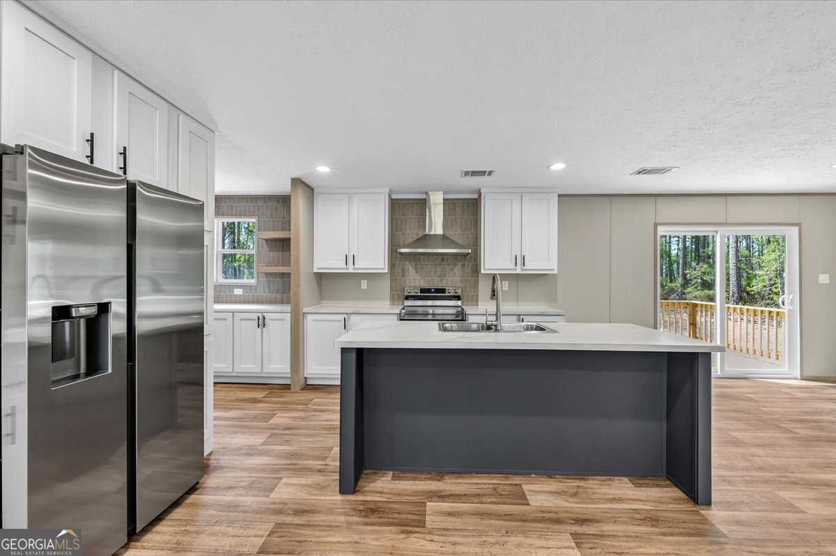 29 Clyde Road White Oak, GA 31568 - Photo 10 of 46 a kitchen with stainless steel appliances granite countertop a sink stove and refrigerator