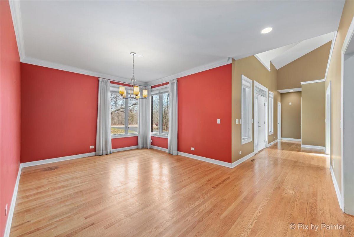 28935 Fox Street Cary, IL 60013 - Photo 15 of 50 a view of an empty room with window and wooden floor