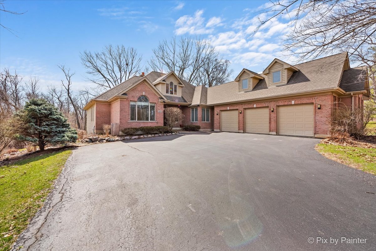 28935 Fox Street Cary, IL 60013 - Photo 2 of 50 a front view of a house with a yard and garage