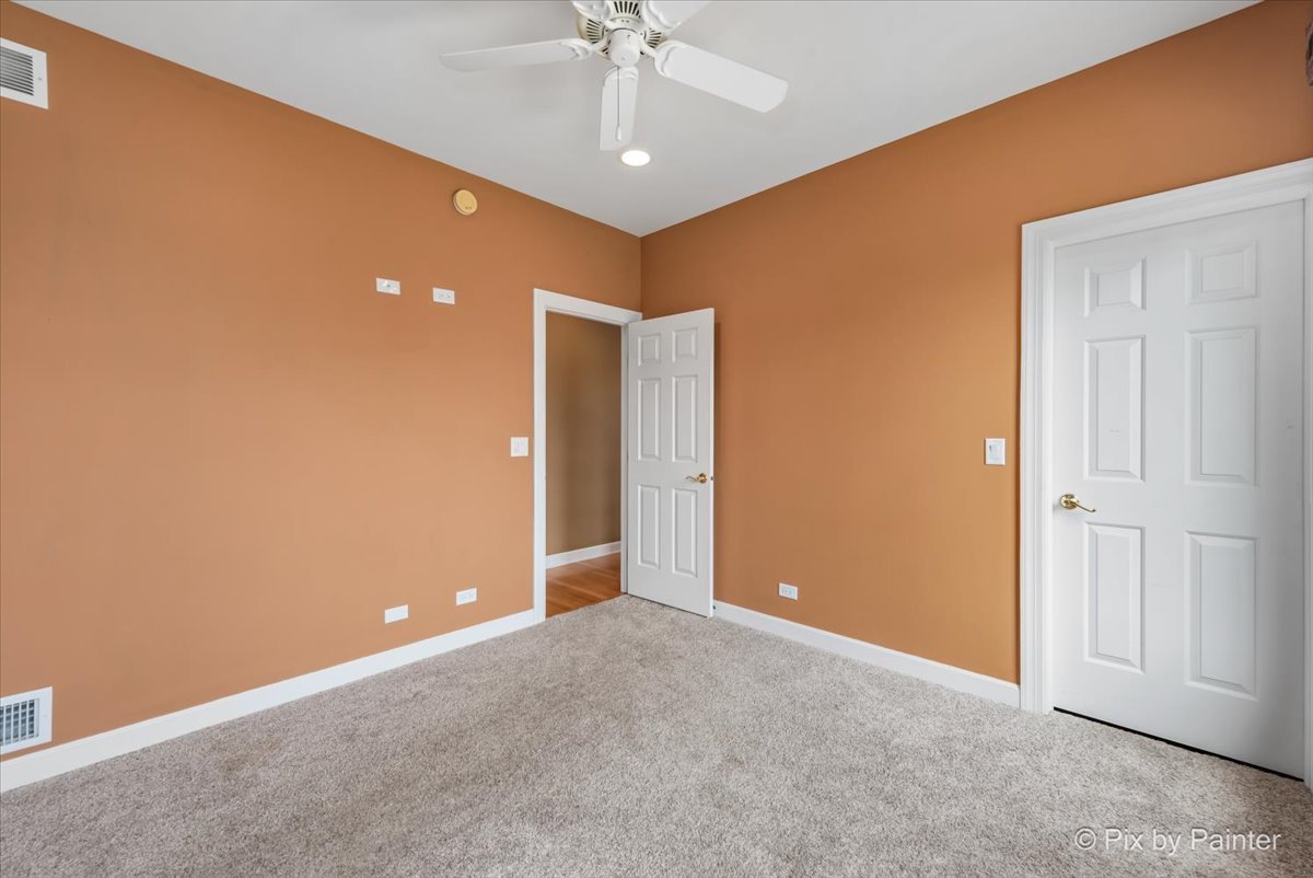 28935 Fox Street Cary, IL 60013 - Photo 26 of 50 an empty room with a ceiling fan and closet area