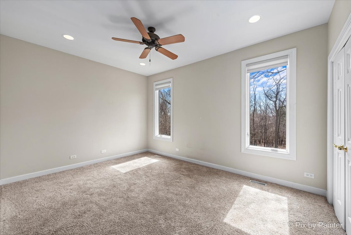 28935 Fox Street Cary, IL 60013 - Photo 28 of 50 a view of a big room with a chandelier fan and windows