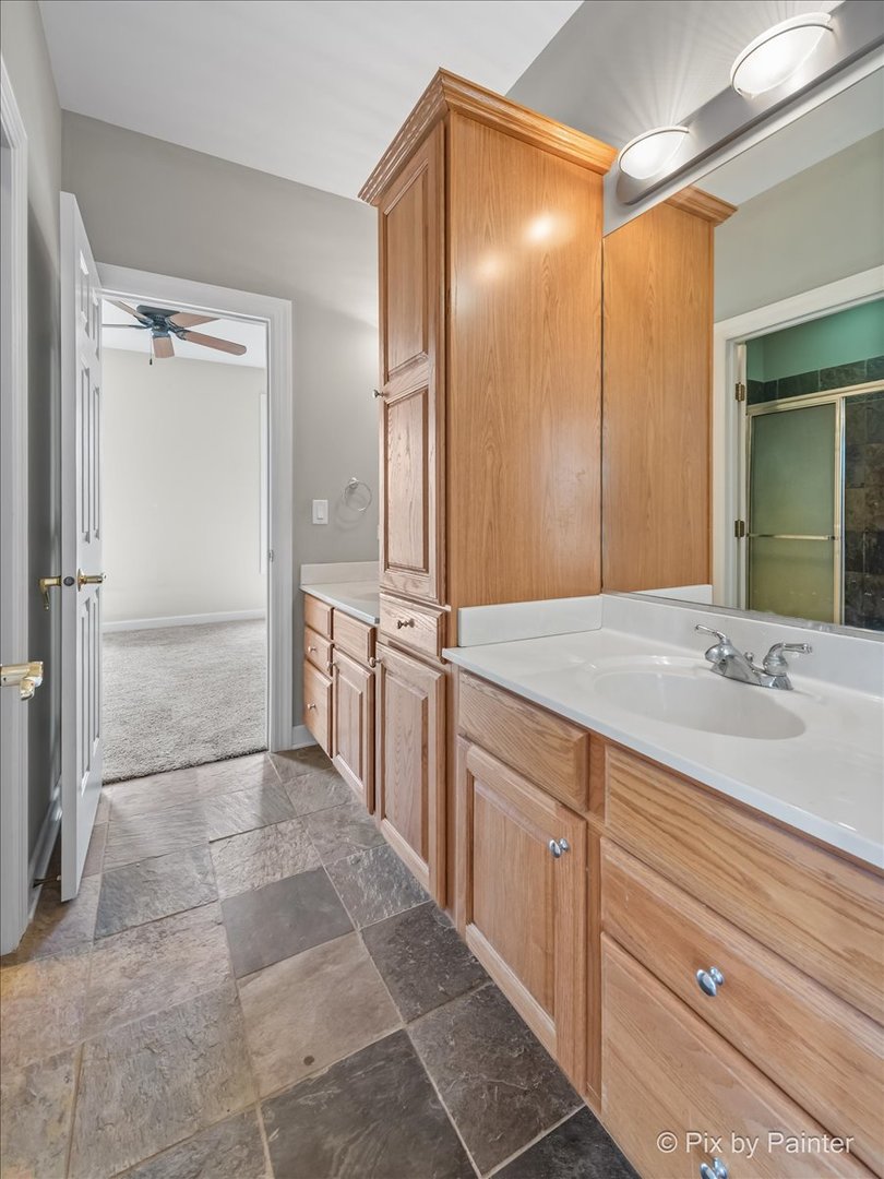 28935 Fox Street Cary, IL 60013 - Photo 30 of 50 a bathroom with a sink and a mirror