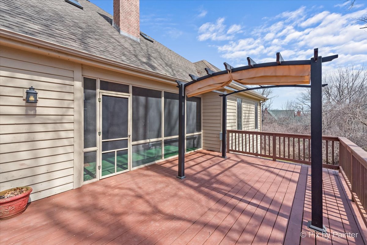 28935 Fox Street Cary, IL 60013 - Photo 41 of 50 a view of balcony with a floor to ceiling window and ceiling fan