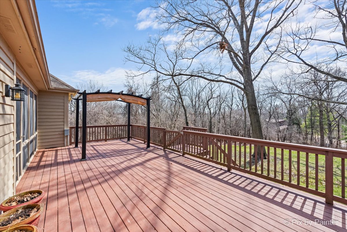 28935 Fox Street Cary, IL 60013 - Photo 43 of 50 a view of balcony with wooden floor and bench