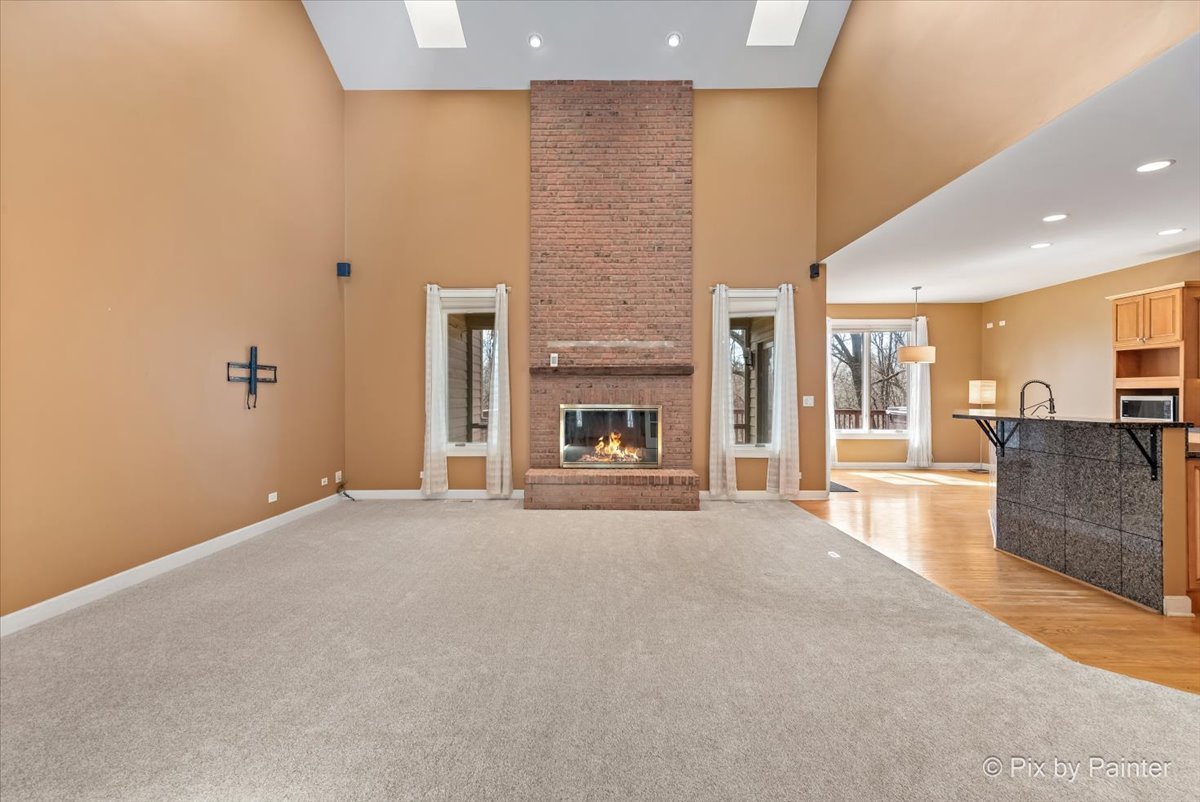 28935 Fox Street Cary, IL 60013 - Photo 5 of 50 a view of an empty room with a fireplace