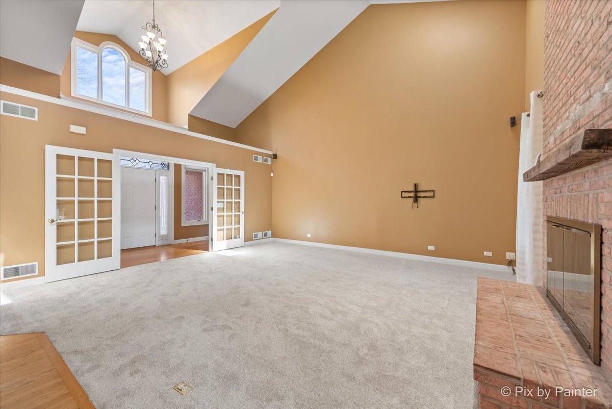 28935 Fox Street Cary, IL 60013 - Photo 7 of 50 a view of an empty room with a fireplace