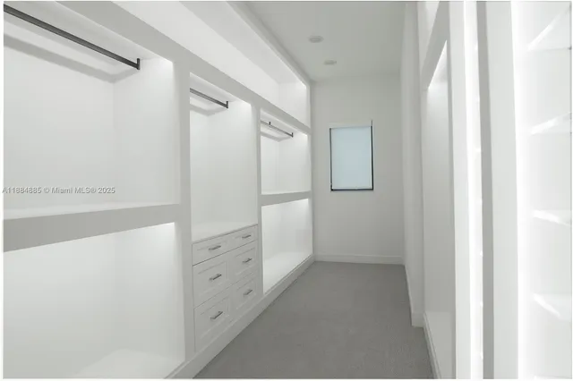 a bathroom with a double vanity sink and mirror