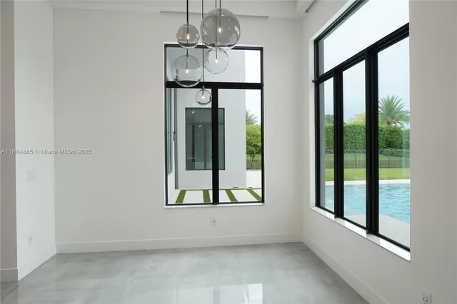 a view of an empty room with glass door
