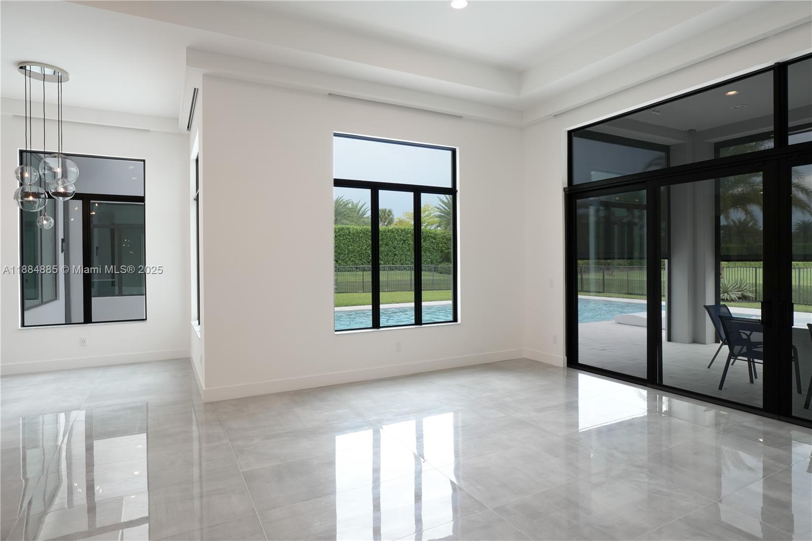 17241 Carretto Court Boca Raton, FL 33496 - Photo 18 of 35 a view of an empty room with glass door
