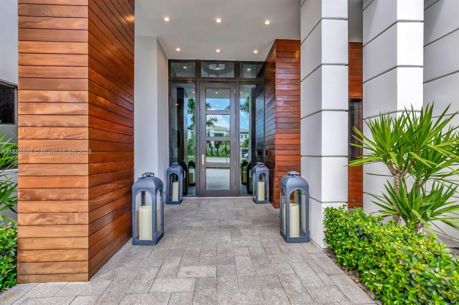 17241 Carretto Court Boca Raton, FL 33496 - Photo 2 of 35 a view of a path along with potted plants