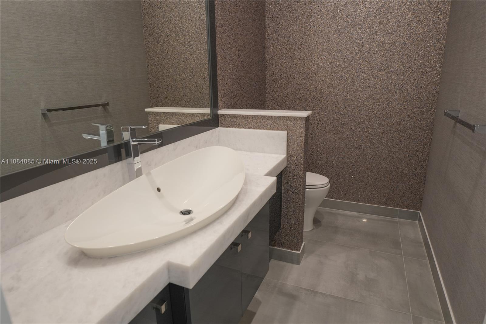17241 Carretto Court Boca Raton, FL 33496 - Photo 23 of 35 a bathroom with a sink and a toilet