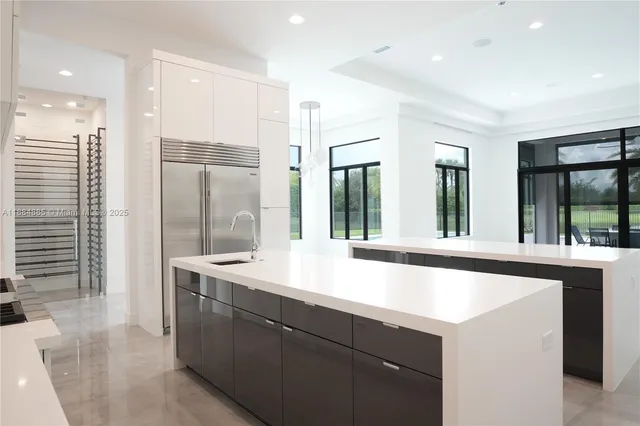 a kitchen with counter top space and sink