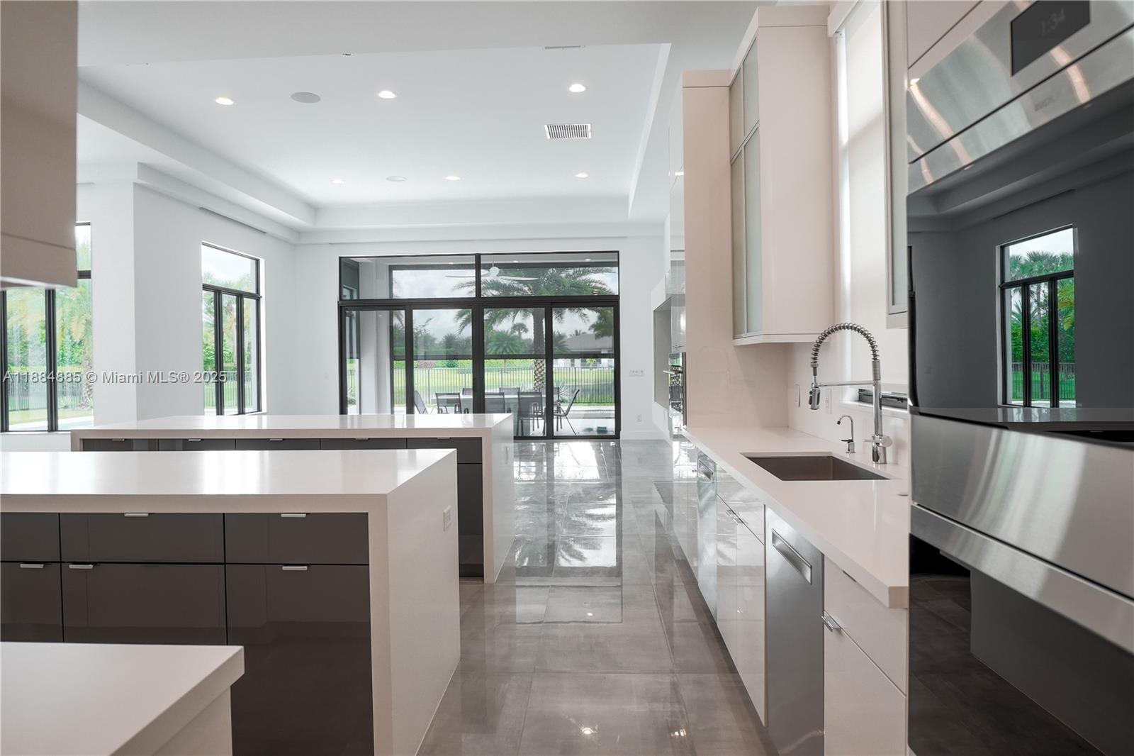 17241 Carretto Court Boca Raton, FL 33496 - Photo 27 of 35 a kitchen with counter top space and sink
