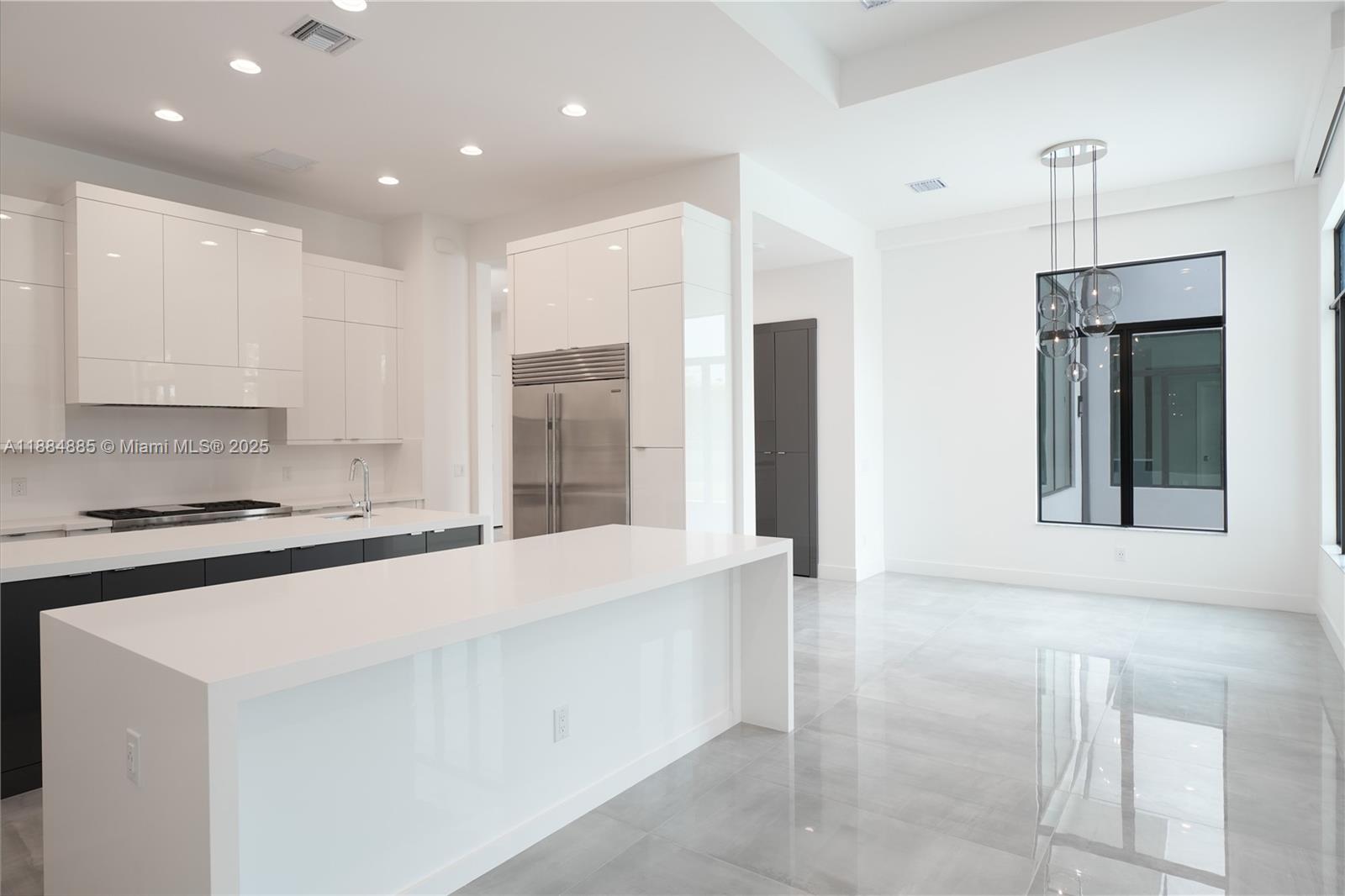 17241 Carretto Court Boca Raton, FL 33496 - Photo 28 of 35 a kitchen with stainless steel appliances granite countertop a stove a refrigerator and a sink