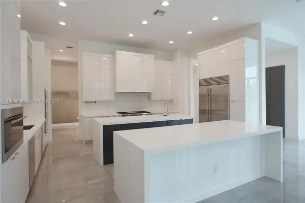 a view of storage and utility room with washer and dryer