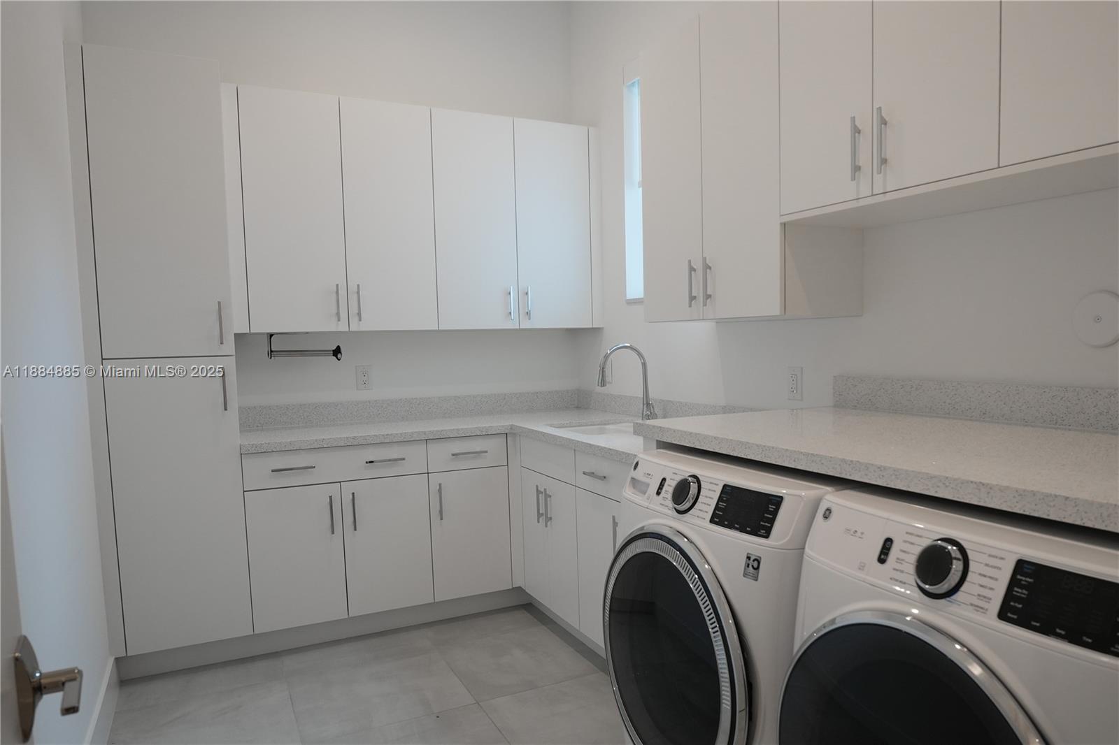 17241 Carretto Court Boca Raton, FL 33496 - Photo 31 of 35 a view of storage and utility room with washer and dryer