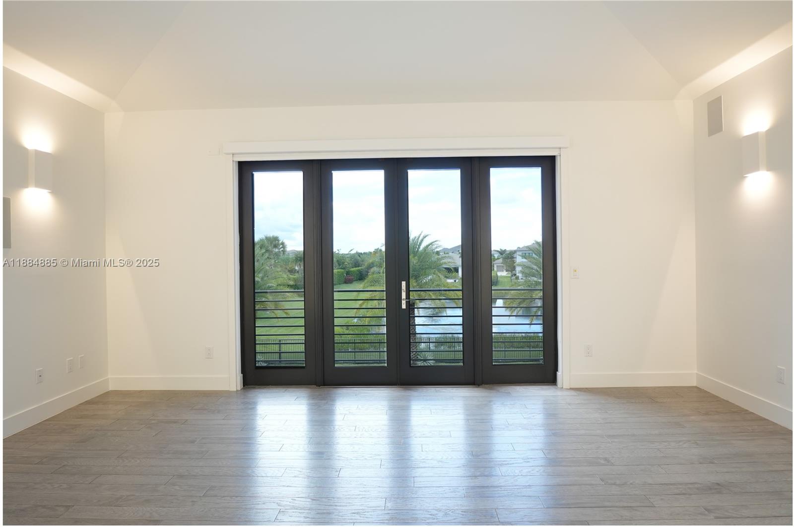 17241 Carretto Court Boca Raton, FL 33496 - Photo 32 of 35 an empty room with wooden floor and windows