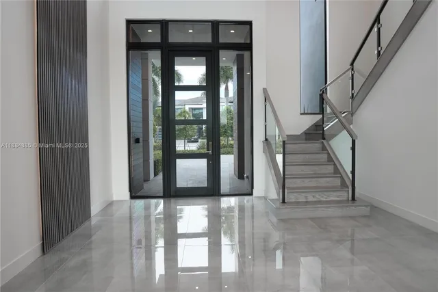 a view of a house with a swimming pool and a yard