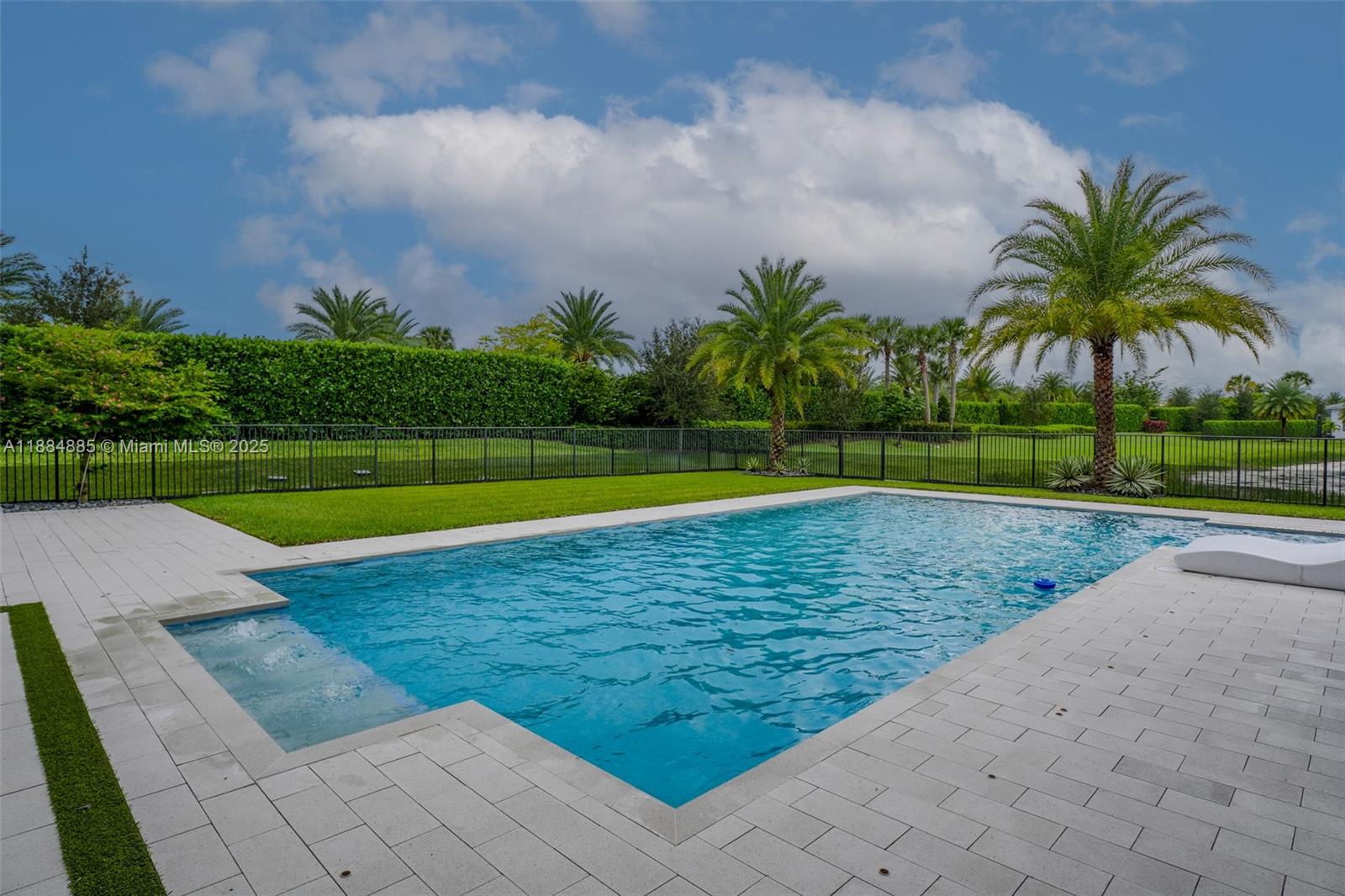 17241 Carretto Court Boca Raton, FL 33496 - Photo 35 of 35 a view of a swimming pool and a yard
