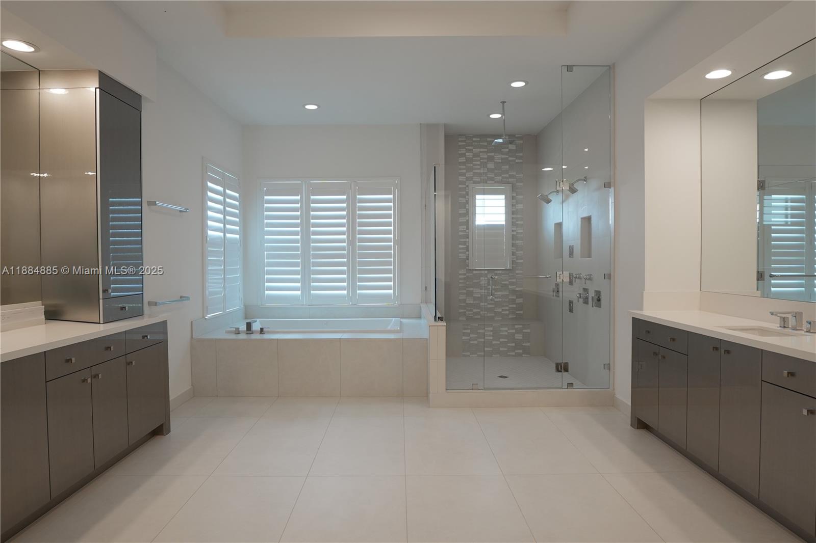 17241 Carretto Court Boca Raton, FL 33496 - Photo 7 of 35 a bathroom with a bathtub a shower a sink and a bathtub