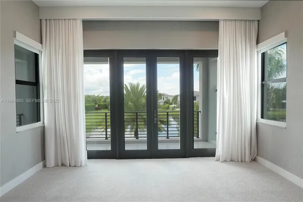 a view of empty room with floor to ceiling window