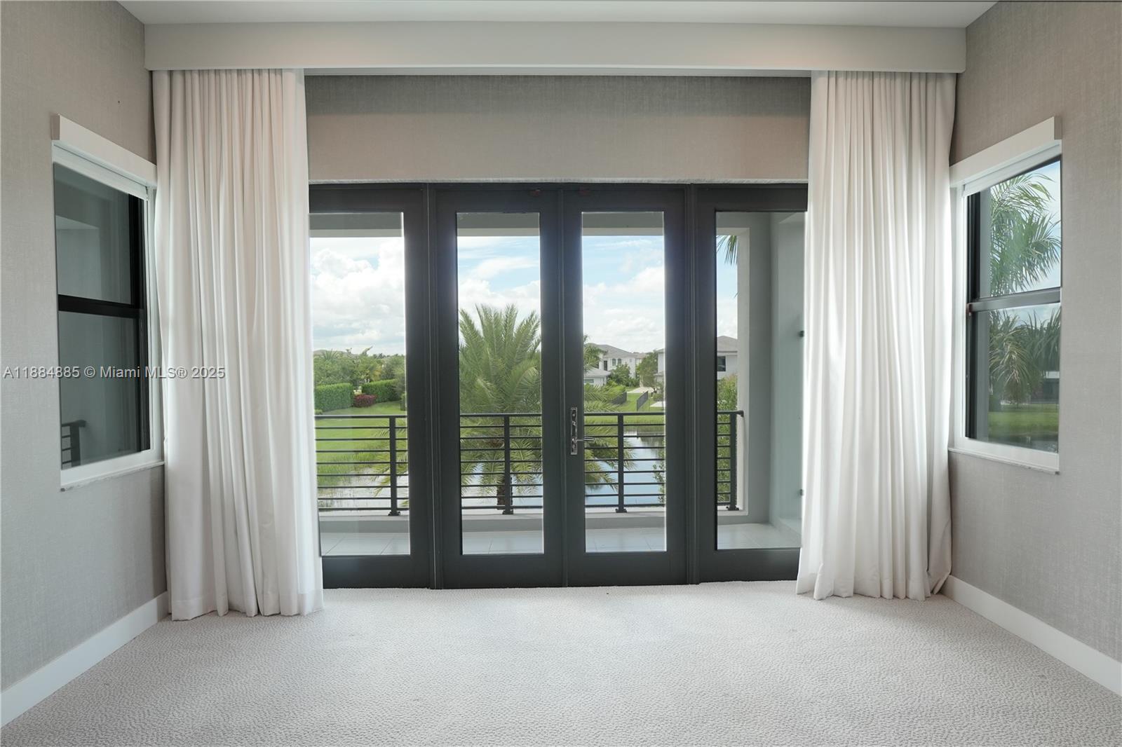 17241 Carretto Court Boca Raton, FL 33496 - Photo 10 of 35 a view of empty room with floor to ceiling window