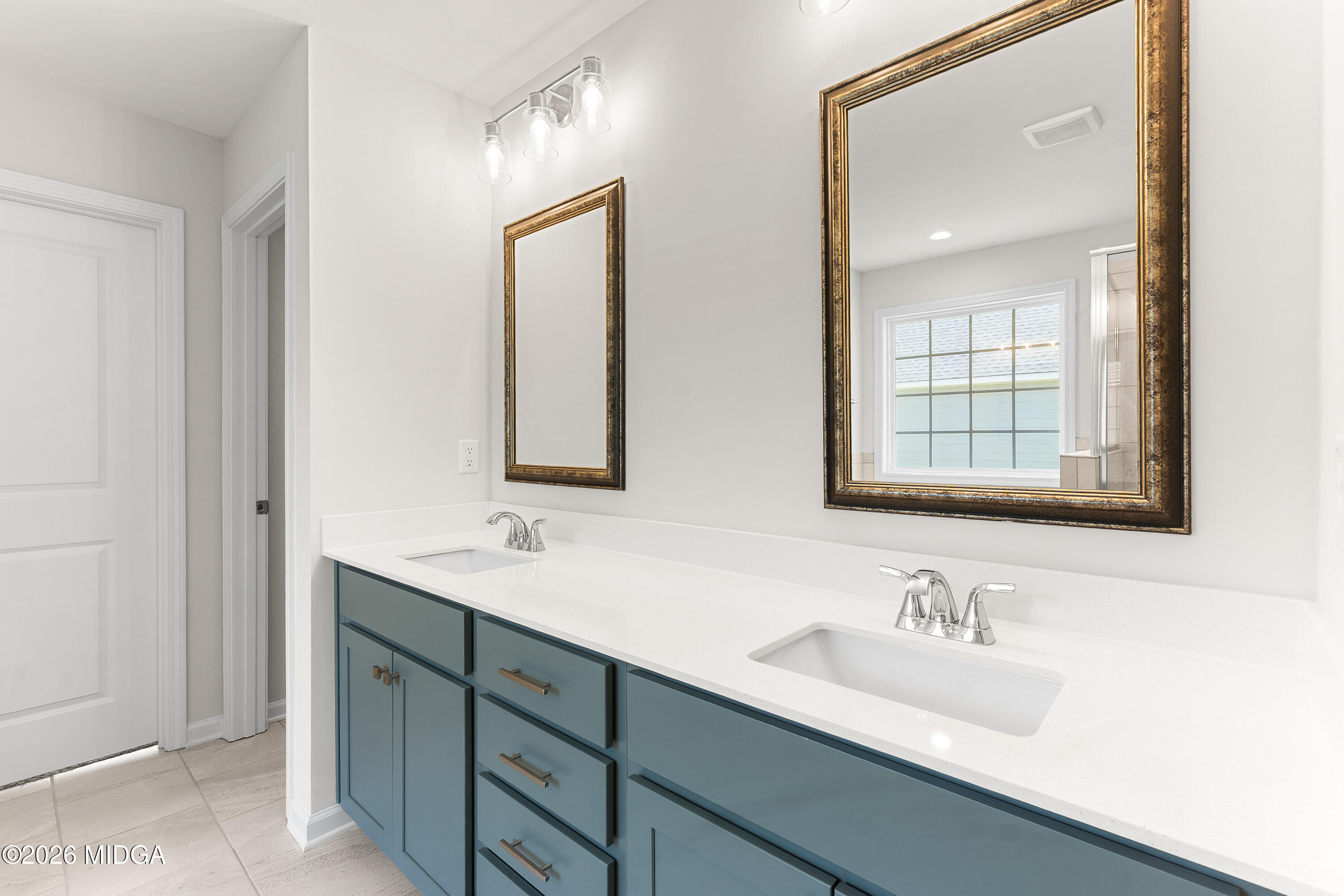 5393 Felles Way, Unit 359 Forsyth, GA 31029 - Photo 31 of 54 a bathroom with double sink and a mirror