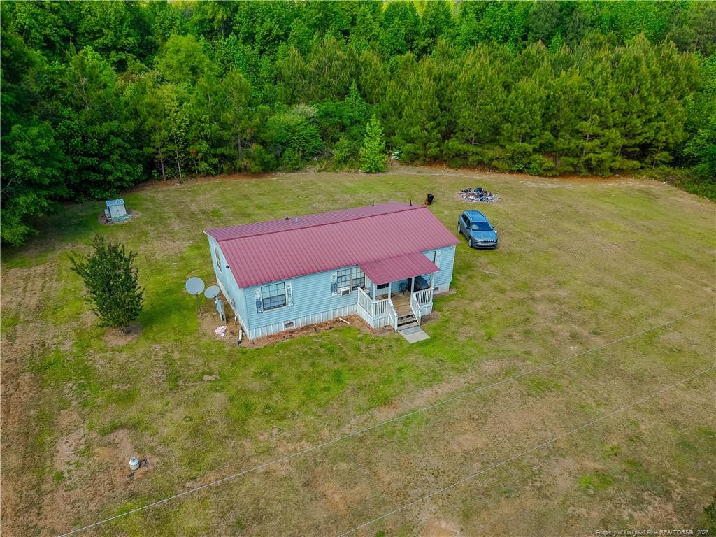 231 Knight Lane Autryville, NC 28318 - Photo 8 of 27 a view of a yard with an outdoor space