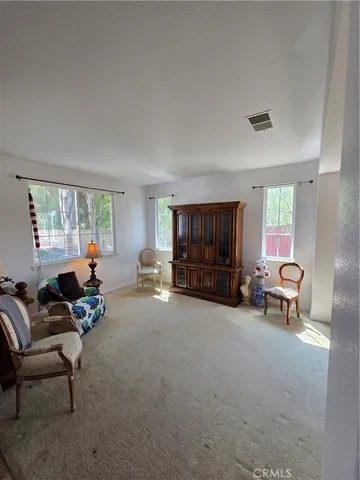a view of a balcony with wooden fence and floor