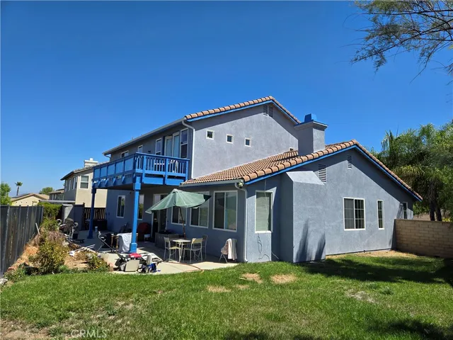 a bedroom with two beds and a flat screen tv