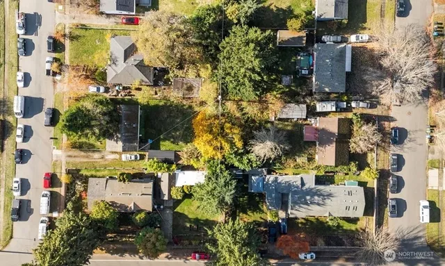 an aerial view of residential houses with outdoor space