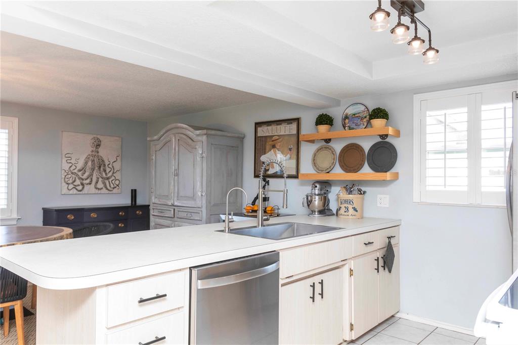 6324 Patella Avenue New Port Richey, FL 34653 - Photo 14 of 36 a bathroom with a sink a vanity and a mirror