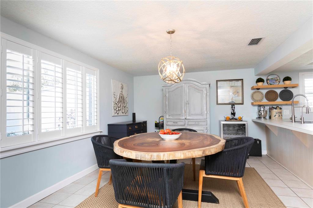 6324 Patella Avenue New Port Richey, FL 34653 - Photo 15 of 36 a table and chairs in a room