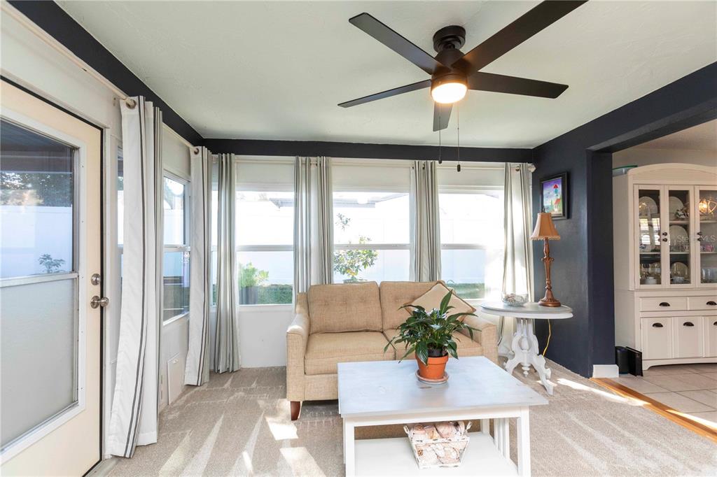 6324 Patella Avenue New Port Richey, FL 34653 - Photo 21 of 36 a living room with furniture and a large window