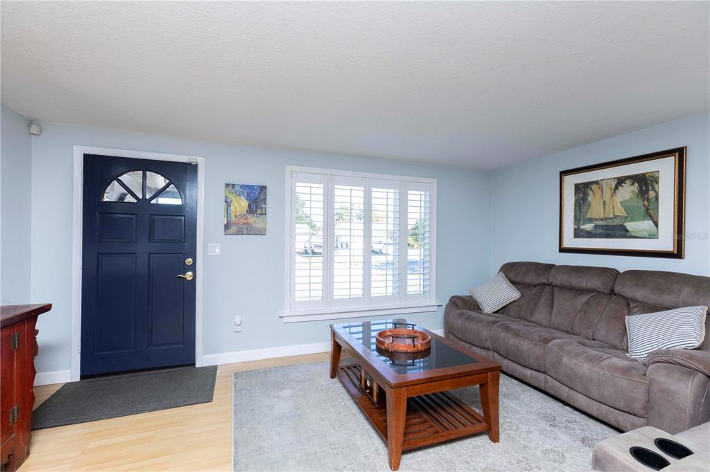 6324 Patella Avenue New Port Richey, FL 34653 - Photo 5 of 36 a living room with furniture and a window