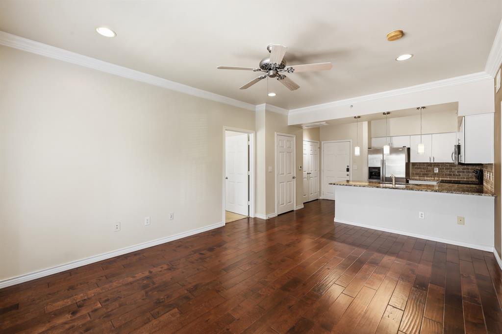 3102 Kings Road, Unit 2212 Dallas, TX 75219 - Photo 7 of 30 a view of an empty room with kitchen view and a window