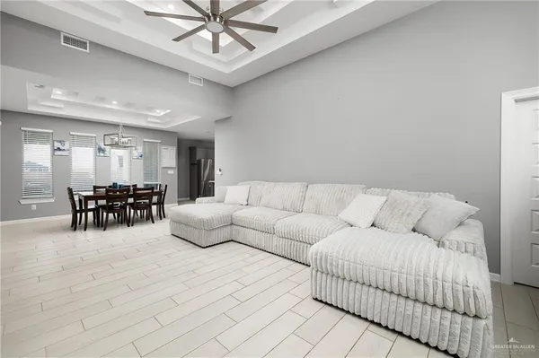 a living room with furniture and white walls
