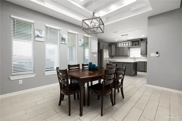 a view of a dining room with furniture and window