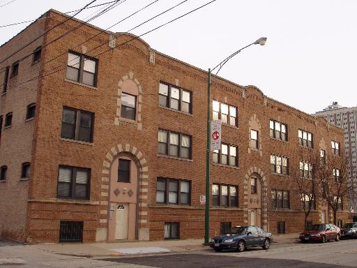 45 North Paulina Street, Unit 1 Chicago, IL 60612 - Photo 11 of 11 a car parked in front of a brick building