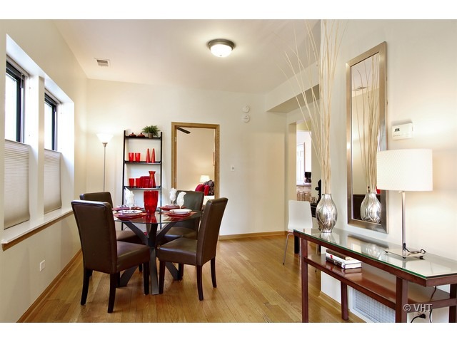 45 North Paulina Street, Unit 1 Chicago, IL 60612 - Photo 6 of 11 a view of a dining room with furniture and wooden floor