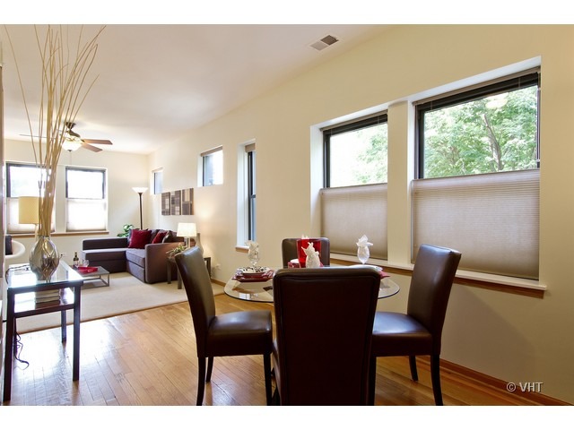 45 North Paulina Street, Unit 1 Chicago, IL 60612 - Photo 7 of 11 a view of a dining room with furniture window and outside view