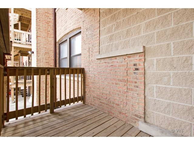 45 North Paulina Street, Unit 1 Chicago, IL 60612 - Photo 10 of 11 a view of wooden floor with a building