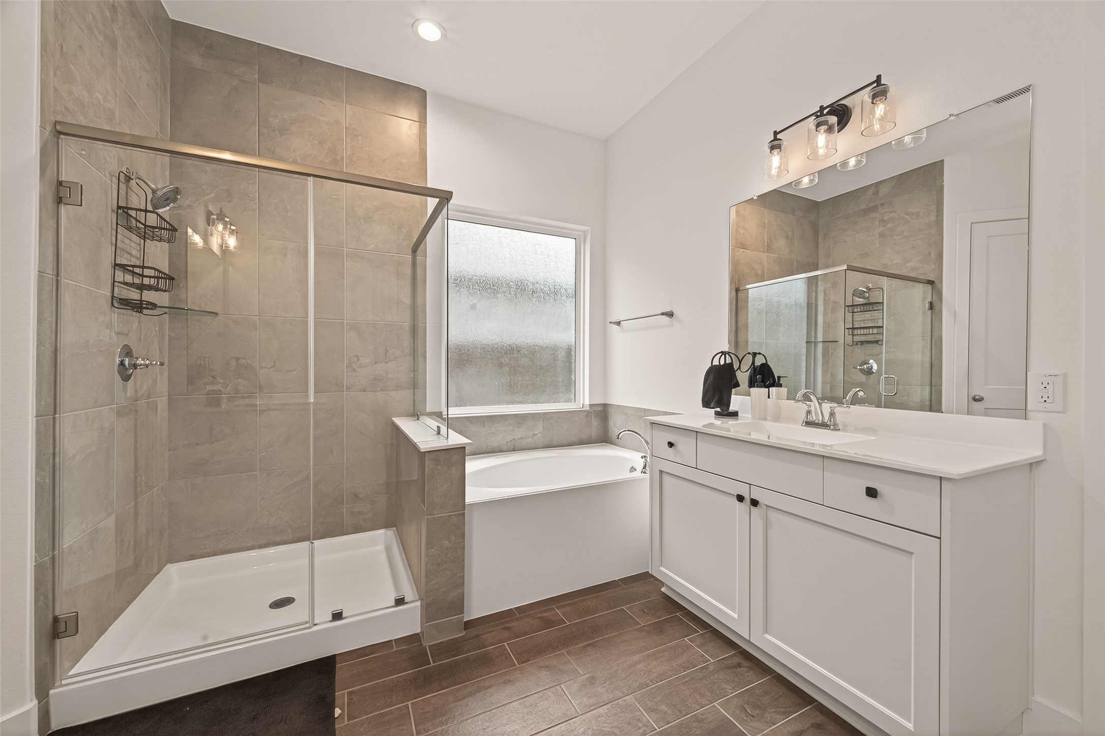 5019 Country Mdws Trail Rosharon, TX 77583 - Photo 36 of 49 a bathroom with a double vanity sink mirror double and shower