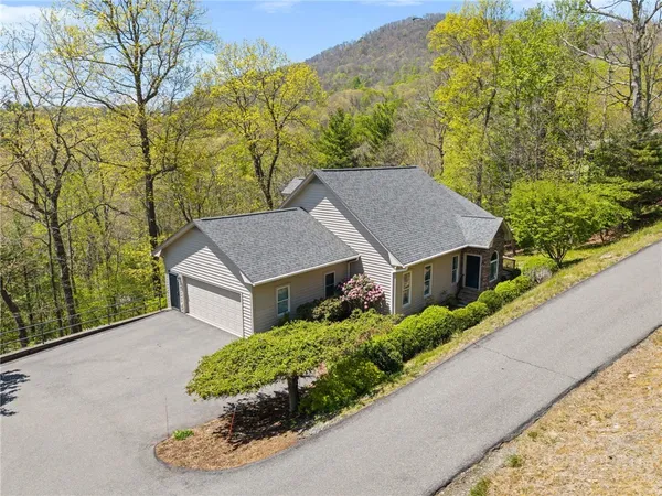 a house with trees in the background