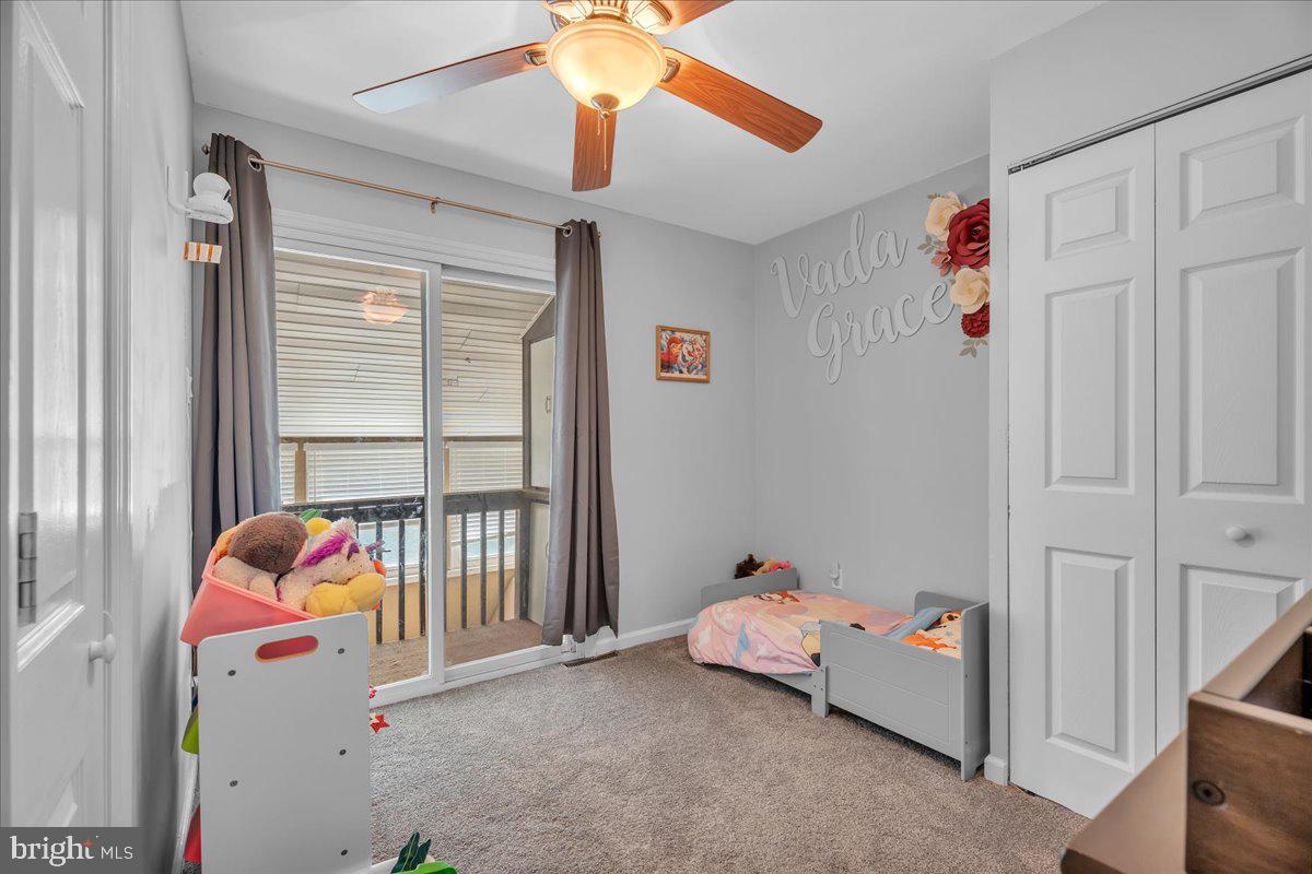 528 Rowand Avenue Glendora, NJ 08029 - Photo 13 of 24 a living room with baby crib furniture and a window