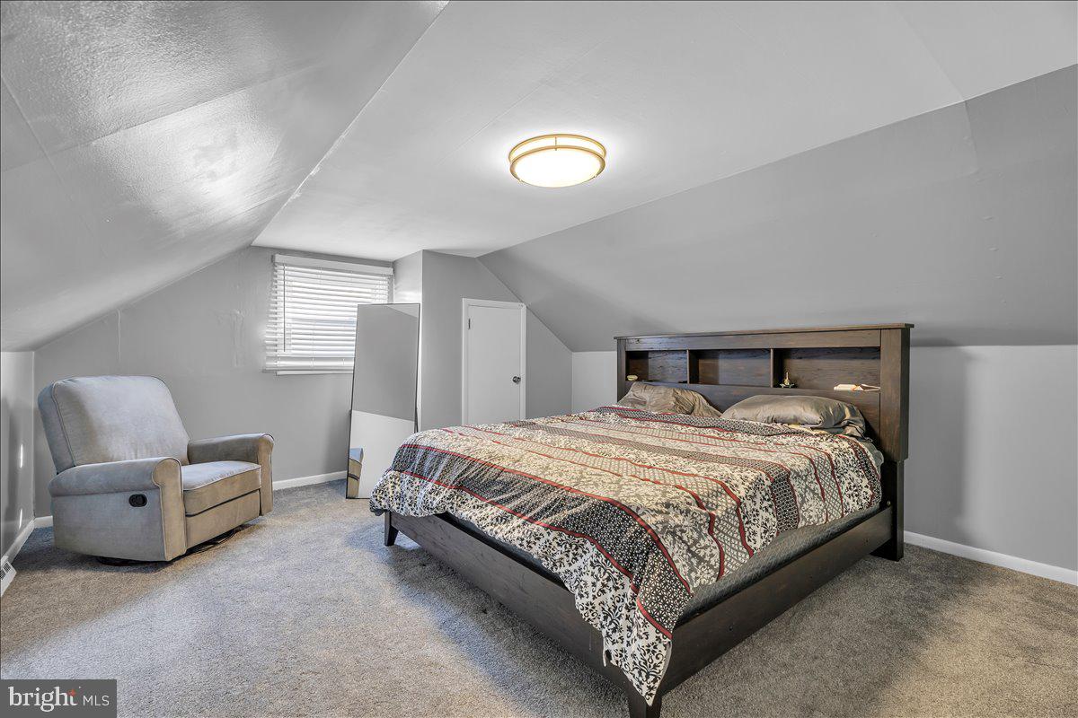 528 Rowand Avenue Glendora, NJ 08029 - Photo 15 of 24 a bedroom with a bed and a chair