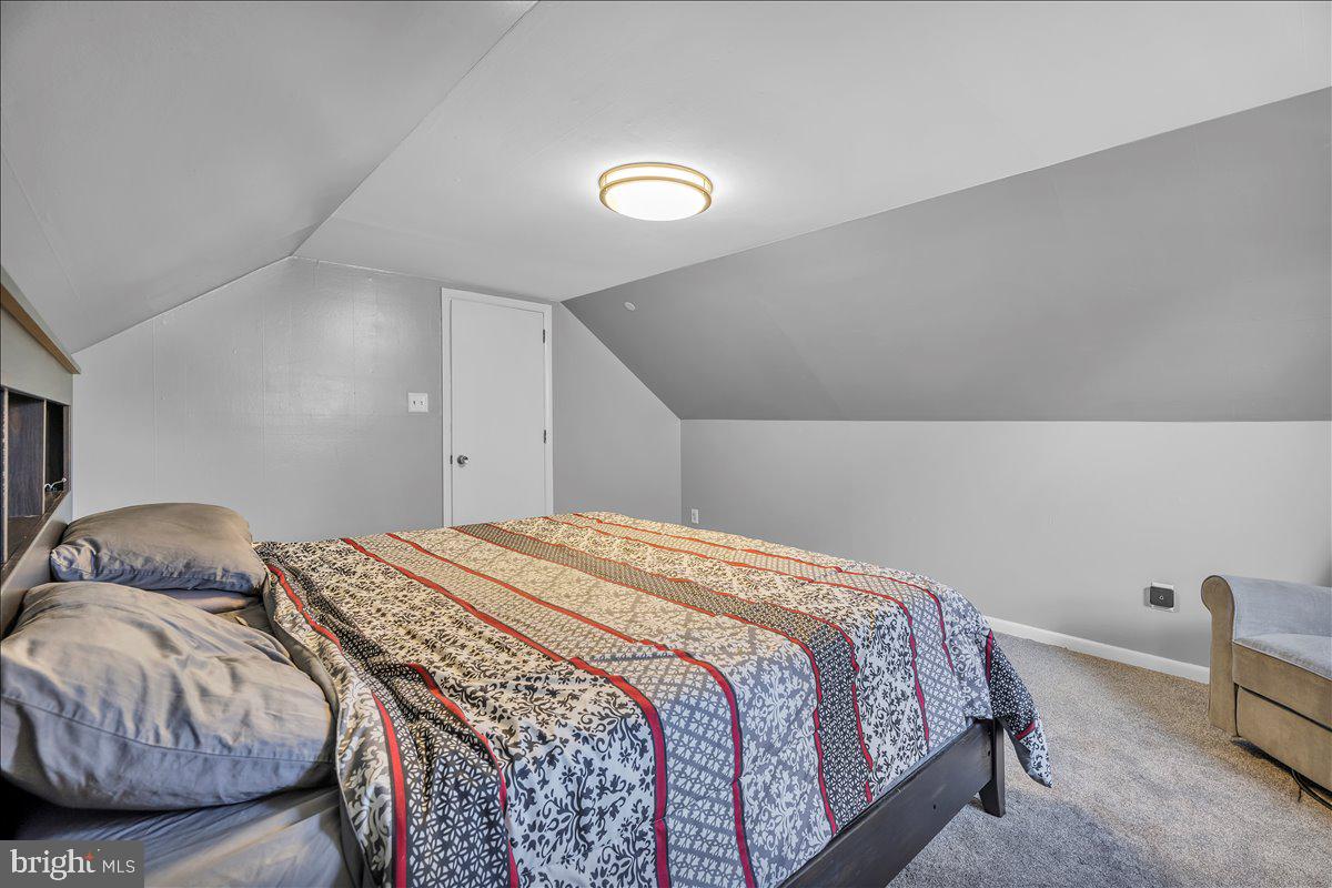 528 Rowand Avenue Glendora, NJ 08029 - Photo 16 of 24 a bedroom with a bed and a chair