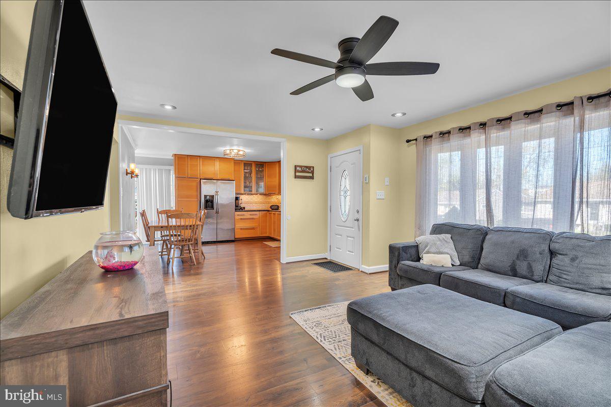 528 Rowand Avenue Glendora, NJ 08029 - Photo 7 of 24 a living room with furniture and a flat screen tv