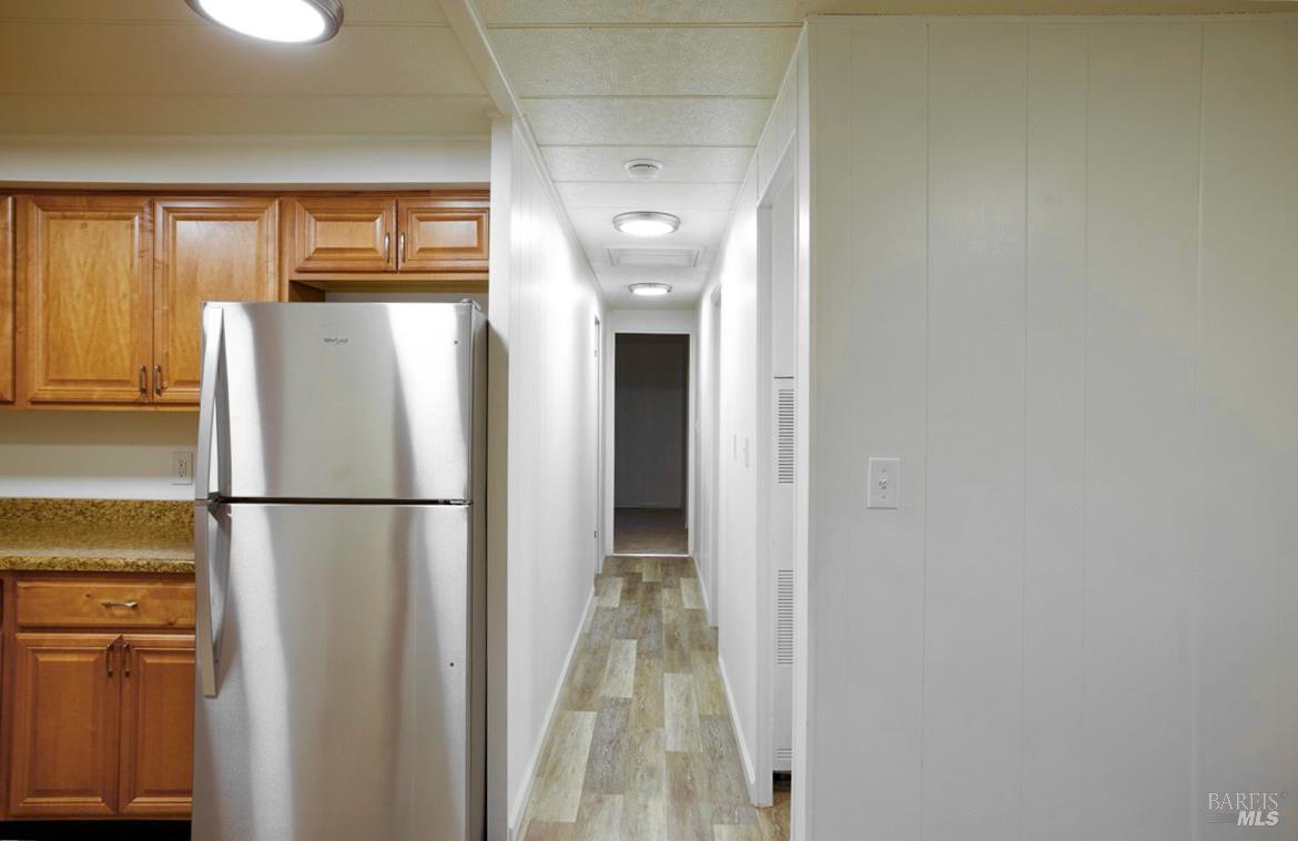 150 Silverado Trail, Unit 64 Napa, CA 94559 - Photo 13 of 21 a white refrigerator freezer and a stove sitting inside of a kitchen