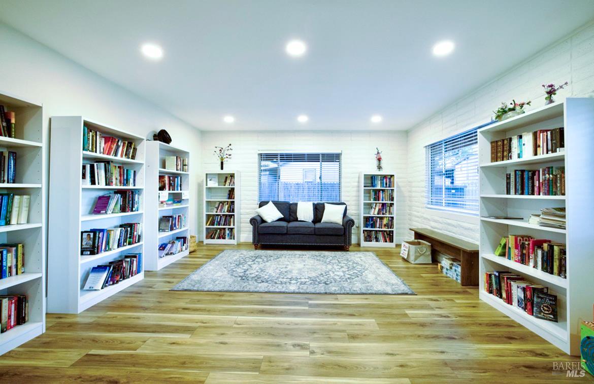 150 Silverado Trail, Unit 64 Napa, CA 94559 - Photo 17 of 21 a living room with furniture and a book shelf